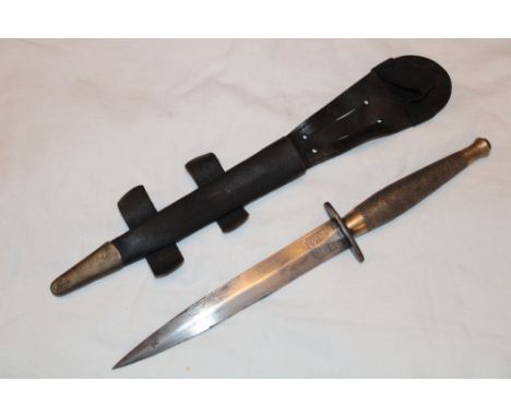 A Second War Indian fighting knife/commando dagger with 7¼" double edged blade, steel oval guard stamped with broad arrow mar