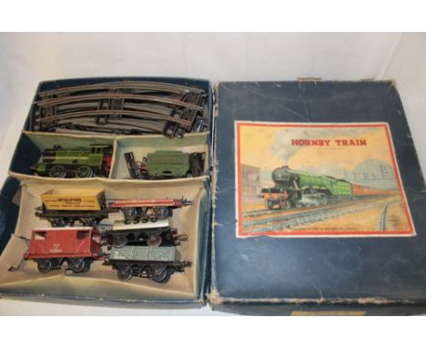 A Hornby 0 Gauge tin plate clockwork train set No. 601 comprising LNER clockwork reversing tank engine and tender, four goods