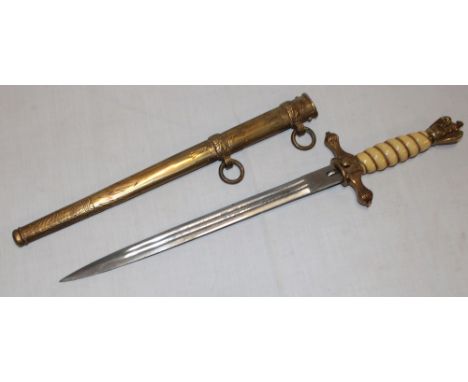 A Second War German Naval Kriegsmarine dagger with 10" etched blade by E Horster of Solingen with brass traditional hilt in b