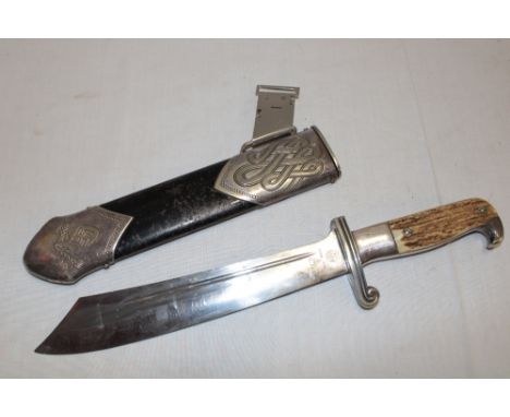 An original Second War German RAD dagger with single edged blade by Carl Eickhorn of Solingen, antler grips and silver plated