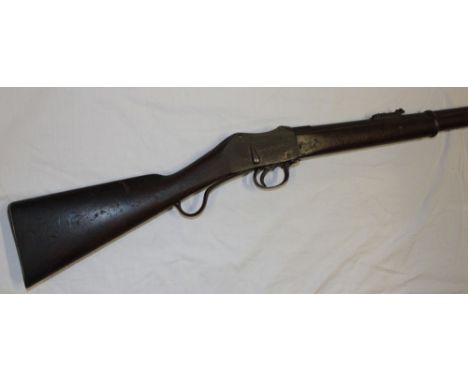 A Martini Henry .577/450 military rifle with 32" steel barrel, Martini action with short lever and polished walnut stock with