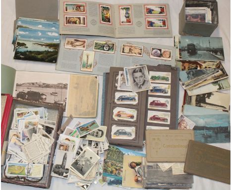 Various black and white and coloured postcards - British and Foreign scenic views together with various albums and loose ciga