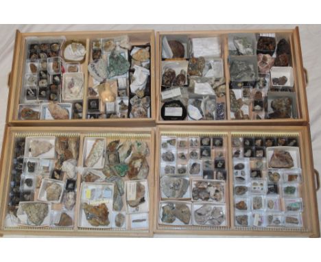 A wooden four drawer display cabinet containing a collection of various minerals including Cornish and West Country examples 