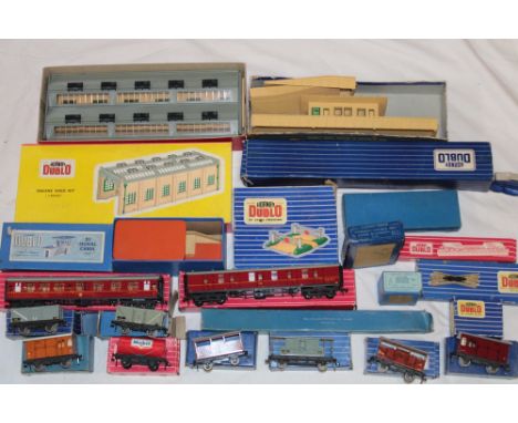 Hornby Dublo - two boxed corridor coaches, a selection of boxed track, signal cabin, engine shed kit and related items 