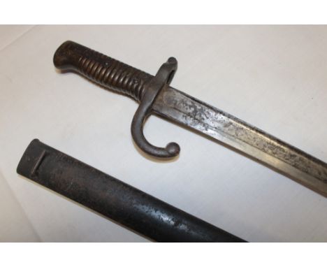 A 19th Century French Chassepot bayonet with single edged blade date 1879 in steel scabbard