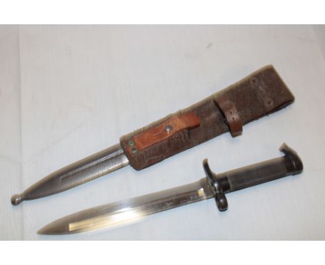 A Swedish Mauser bayonet with chequered steel hilt in steel scabbard with leather frog 