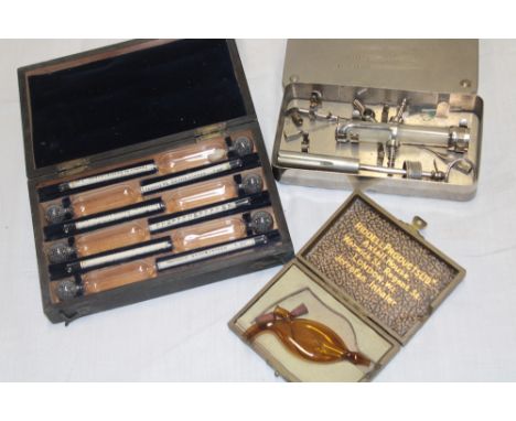 A small selection of various medical instruments including French transfusion syringe by Louis Jube, Jerrofan inhaler by Ridd