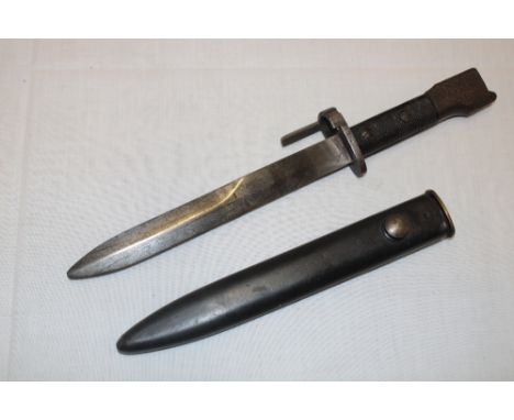 An FN-FAL bayonet with single edged blade in steel scabbard (slight damage) 