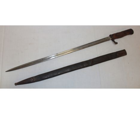 A First War German Mauser bayonet with long 20½" single edged blade marked "V.C.S. Suhl" in steel mounted leather scabbard 