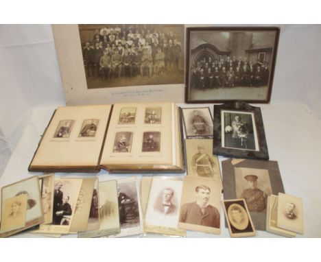 A family photograph album containing a selection of Victorian cabinet photographs and carte de visits together with various o