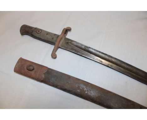 An 1855 pattern Enfield sword bayonet with single edged blade, leather grips and steel mounted leather scabbard 