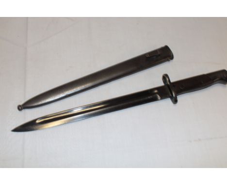 A Portuguese Mauser bayonet with blackened steel single edged blade and steel scabbard 