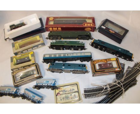 A selection of various OO gauge railway items including Bachmann boxed diesel shunter, various boxed goods wagons, unboxed Ho