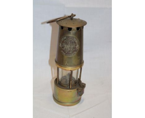 An all-brass miner's lamp by The Protector Lamp and Lighting Co Manchester  