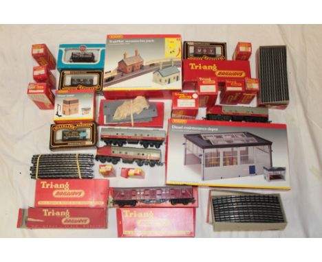 A selection of 00 Gauge railway including Tri-ang boxed track, points, Continental locomotive, Hornby boxed country station a