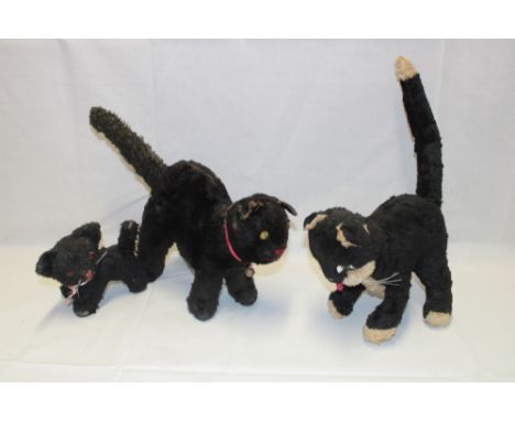 Three old plush covered cat toys