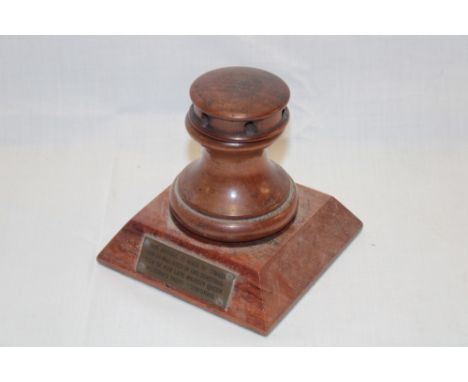 A polished wood capstan-style inkwell "made from timber which was used in the construction of her late Majesty Queen Victoria