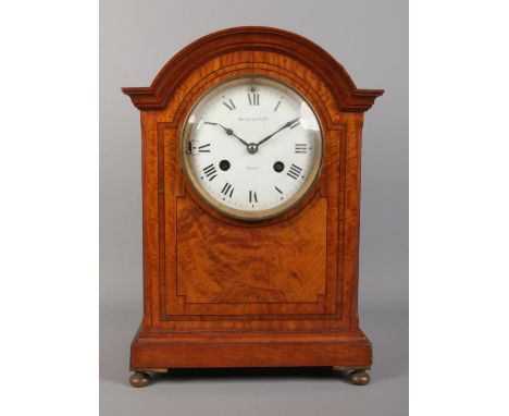 A Maple &amp; Co Ltd. mahogany eight day bracket clock. Having enamel dial, Roman numeral markers and chiming on a coiled gon
