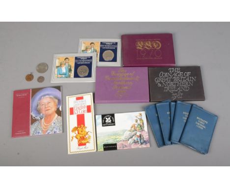 A collection of British commemorative coin packs to include Coinage of Great Britain and Northern Ireland (1970, 1980 and 198