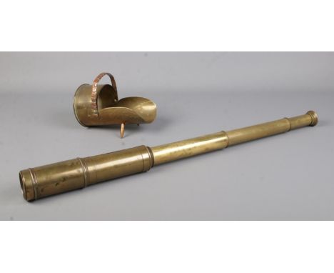 A brass three drawer telescope, accompanied by a piece of trench art formed as a miniature coal scuttle, from a shell case be