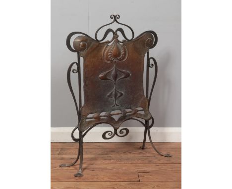 An Arts &amp; Crafts copper and iron fire screen. Height 81.5cm.  