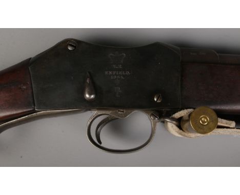 A Victorian Enfield Martini Henry MkIII rifle. Dated 1884. With sling and socket bayonet in scabbard. CANNOT POST.  Good over