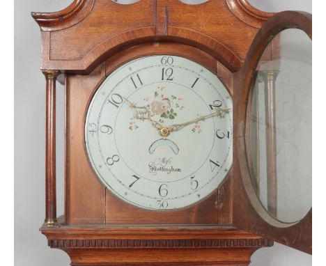 A Georgian oak longcase clock. Having twin swan neck pediment and painted enamel dial marked for Mos Nottingham. Height 212.5