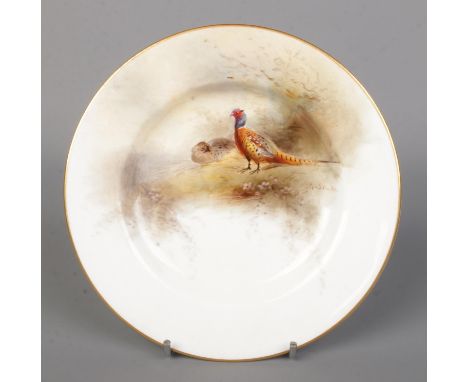 James Stinton for Royal Worcester, a porcelain plate with hand painted scene depicting pheasants in landscape. Diameter 15.5c