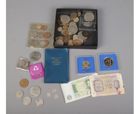 A collection of mostly British pre-decimal coins to include small quantity of silver three pence's, commemorative crowns, Bri