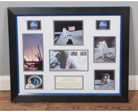 A framed Edgar Dean Mitchell display featuring signed 40th Anniversary of Man on the Moon first day cover surrounding by seve