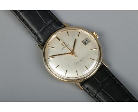 A gents 9ct gold Omega Geneve manual wristwatch. Having centre seconds, baton markers and date display.  Running. Replacement