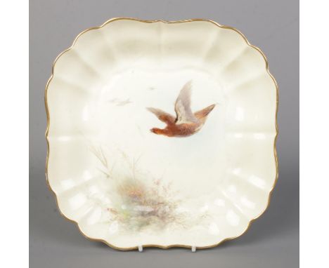 James Stinton for Royal Worcester, a porcelain dish with hand painted scene depicting grouse in flight. Having gilt rim. Stam