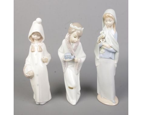Three Lladro ceramic figures to include King Gasper and Shepard from a nativity scene.  Shepard is missing staff.