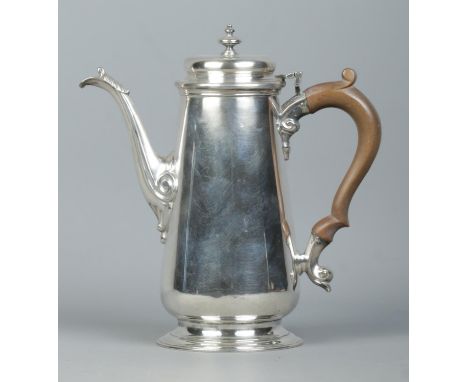 A George VI silver hot water pot with urn shaped finial and wooden handle. Assayed London 1941 by Nathan Bloom &amp; Son Ltd.