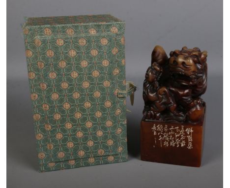 A Chinese carved soapstone chop wax seal stamp surmounted with Foo dog with pup in original presentation box. Approx. dimensi