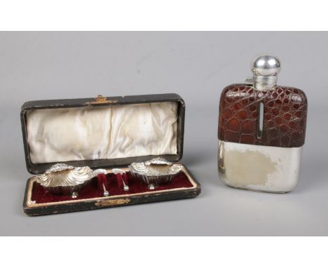 An Edwardian silver cruet set formed as shells, in fitted case, together with a G &amp; J.W Hawksley EPNS hip flask with remo