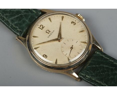 A gents 9ct gold Omega manual wristwatch. Having subsidiary seconds and baton and Arabic numeral markers.  Running.