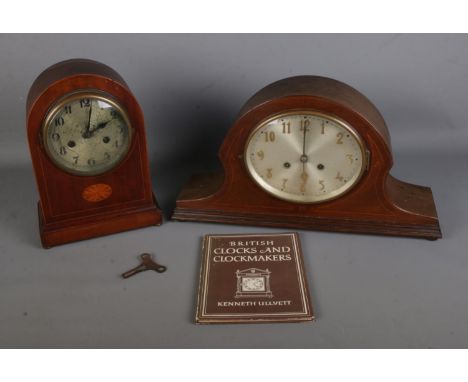 Two inlaid wooden cased mantle clocks along with Kenneth Ullyett: British Clocks and Clockmakers book.  One clock is missing 