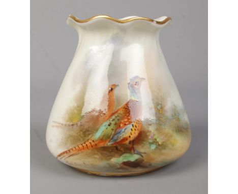 James Stinton for Royal Worcester, a porcelain vase with hand painted decoration depicting a male and female pheasant in land