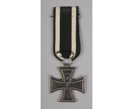 An Imperial German Military First World War iron cross medal with ribbon.  