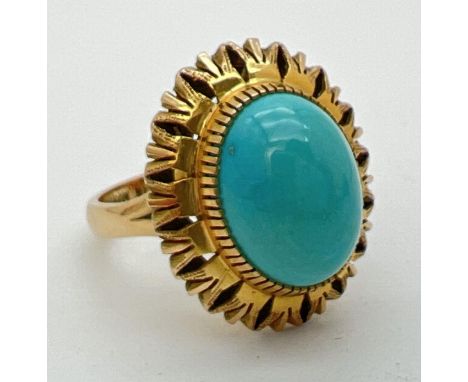 A vintage Mexican 14k gold dress ring set with an oval cut cabochon of turquoise in a sunflower design mount. Inside of band 