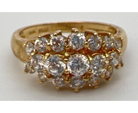 A 14ct gold claw set cluster ring with 19 round cut Diamonique cubic zirconia stones. Full hallmarks to inside of band. Size 