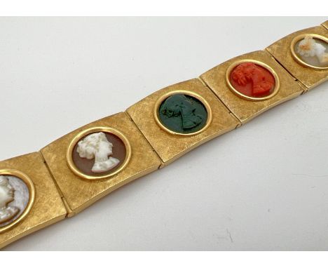 A vintage 8 panel 18ct brushed gold bracelet set with varying colour semi-precious stone cameos. Push clasp with safety clips