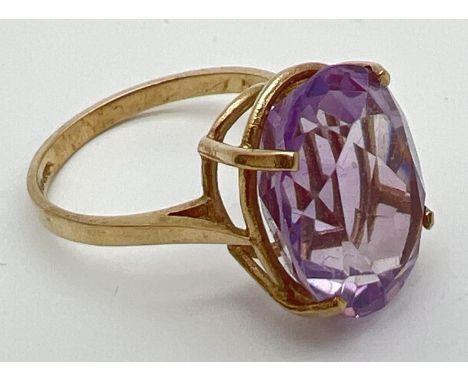 A 9ct gold cocktail ring set with a large oval cut Rose de France amethyst. Stone approx. 16mm x 12mm. Ring size NÂ½. Total w