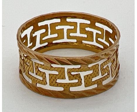 A 14k gold band/wedding ring with pierced work Greek key design. 7mm band width. Marked 585. Total weight 0.8g. Size KÂ½. 