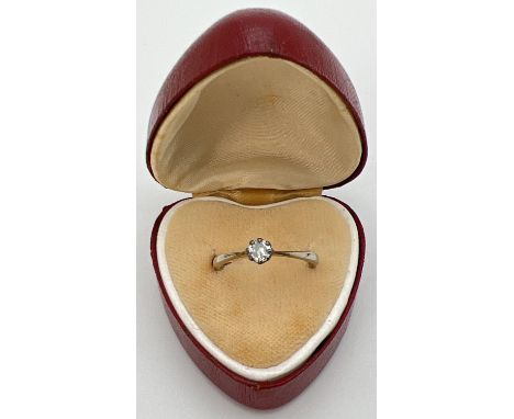 An antique 18ct white gold and platinum .20ct diamond solitaire ring. Gold marks to inside of band. Size NÂ½, total weight ap