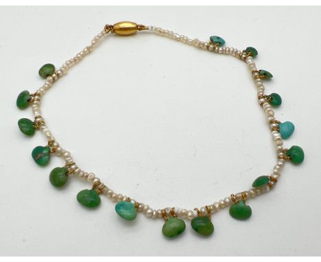 A vintage seed pearl bracelet with green &amp; blue turquoise drops and 14ct gold push clasp. Clasp tests 14ct. Total length 