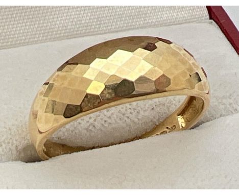 A 18ct gold dome style checkerboard patterned dress ring. Full hallmarks to inside of band. Size R, total weight approx 2.4g.