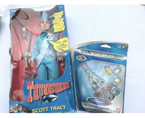 A Carlton Thunderbird figure and a Thunderbird 1 model boxed