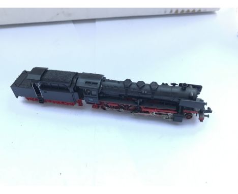 An Fleischmann n gauge locomotive and tender. Plus carriages